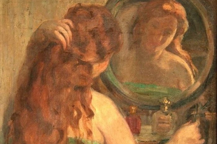 Impressionist oil painting of a woman with long red hair looking into a round mirror while wearing a green dress, with perfume bottles on the table in front of her.